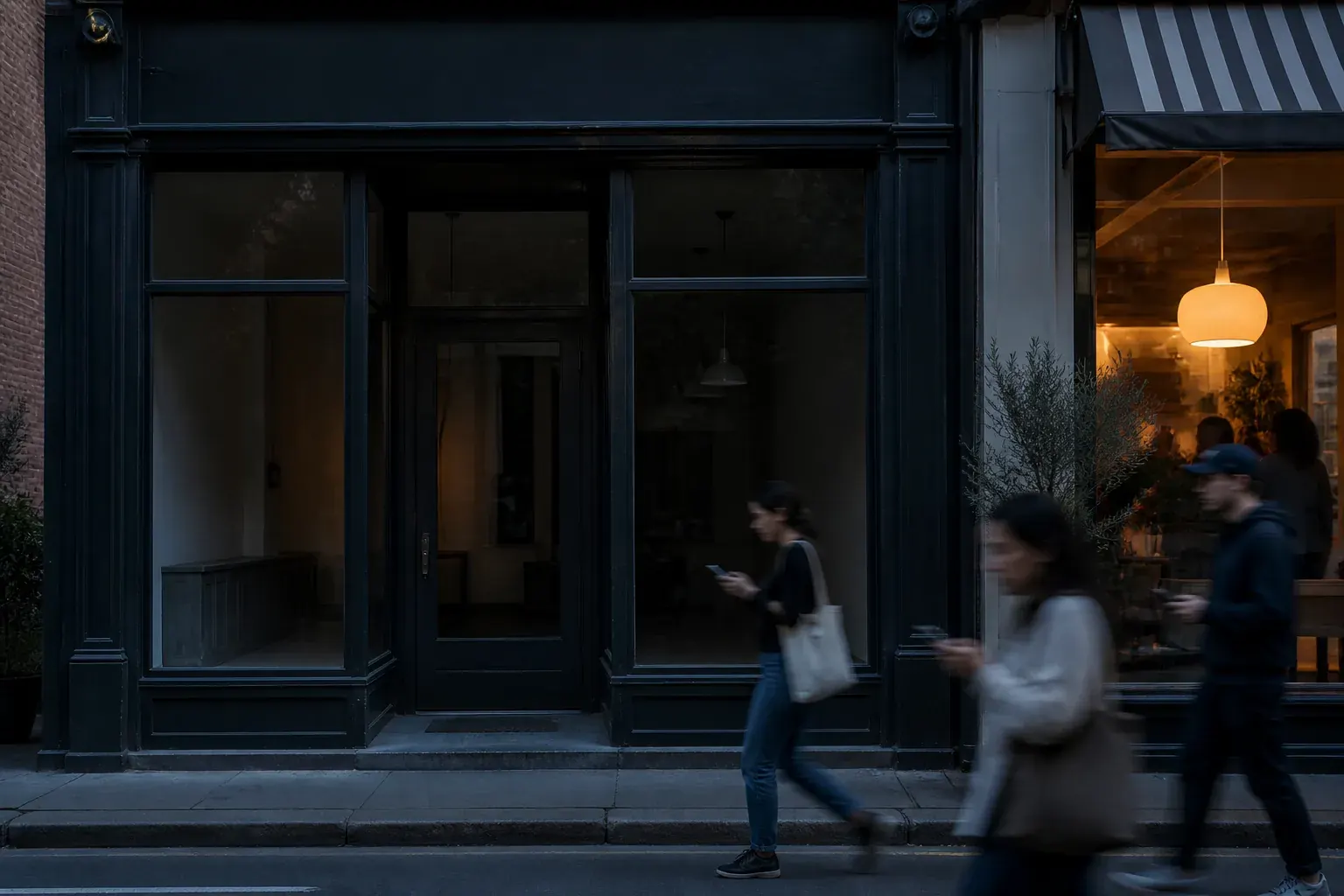 Quiet storefront as potential customers pass while searching on their phones